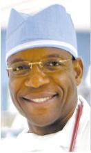 Headshot of Dr Nche Zama in hospital scrubs.